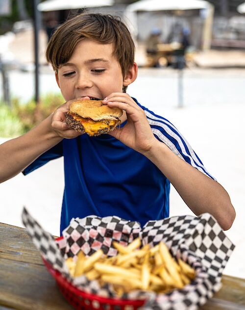Family Fun Night at the Sea to Sky Gondola Backyard Plaza all Summer with free burger and fries for kids under 14 years old