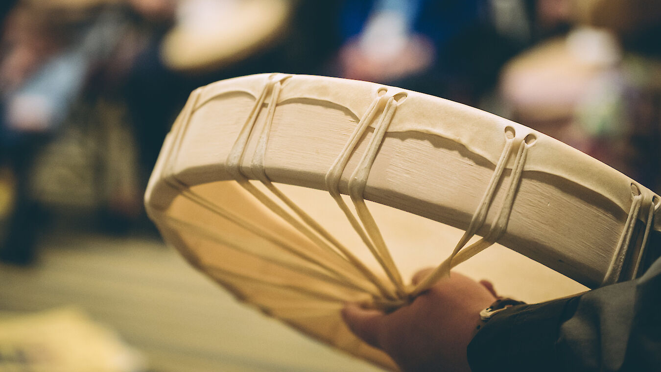 a hand holding a drum