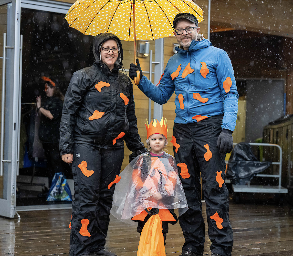 A family of three dressed up for halloween