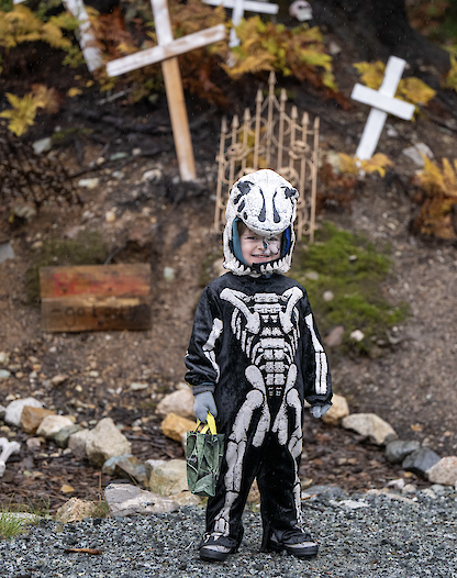 a child dressed up as a skeleton