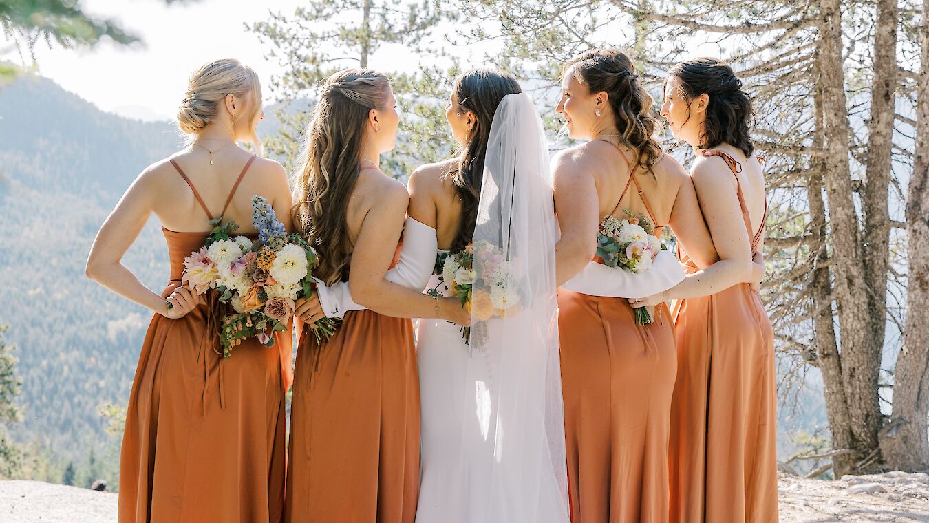 Bridesmaids holding bouquets of flowers