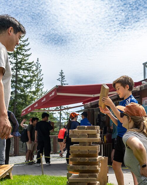 a family playing jenga