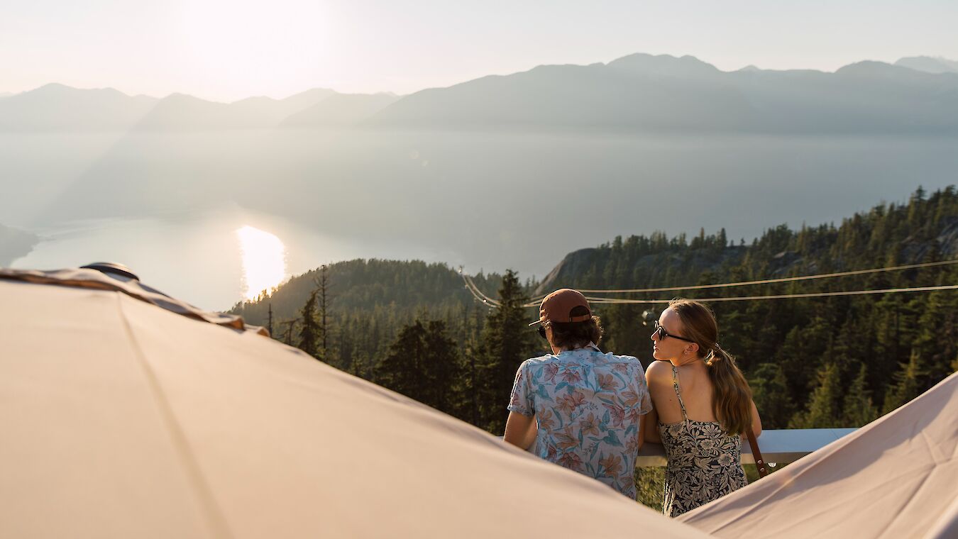 a couple looking out at the view and sunset