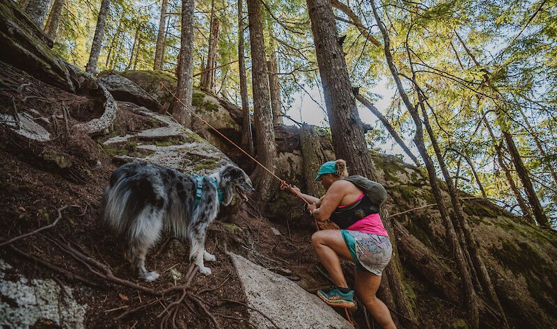 a women hiking with her dog