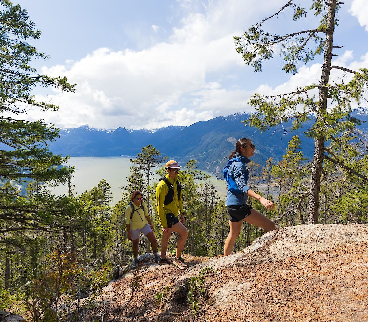 three people hiking on the climb