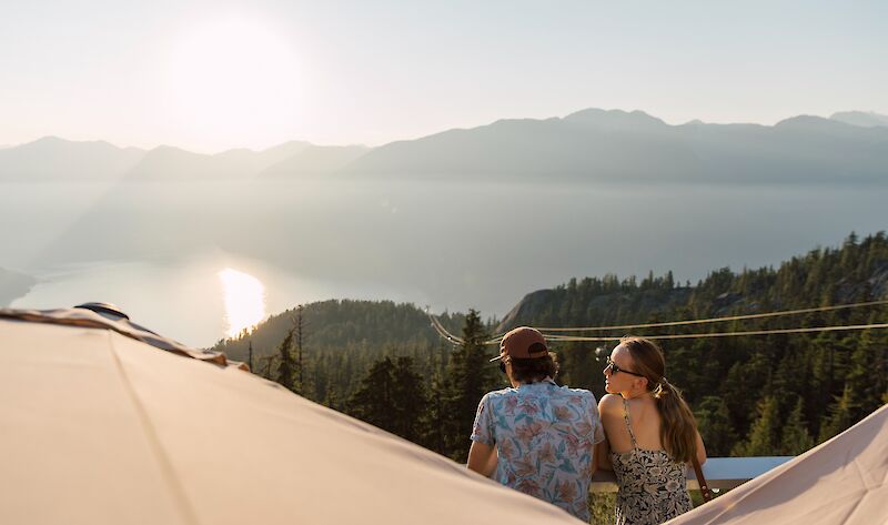 a couple looking at the ocean view from the summit patio