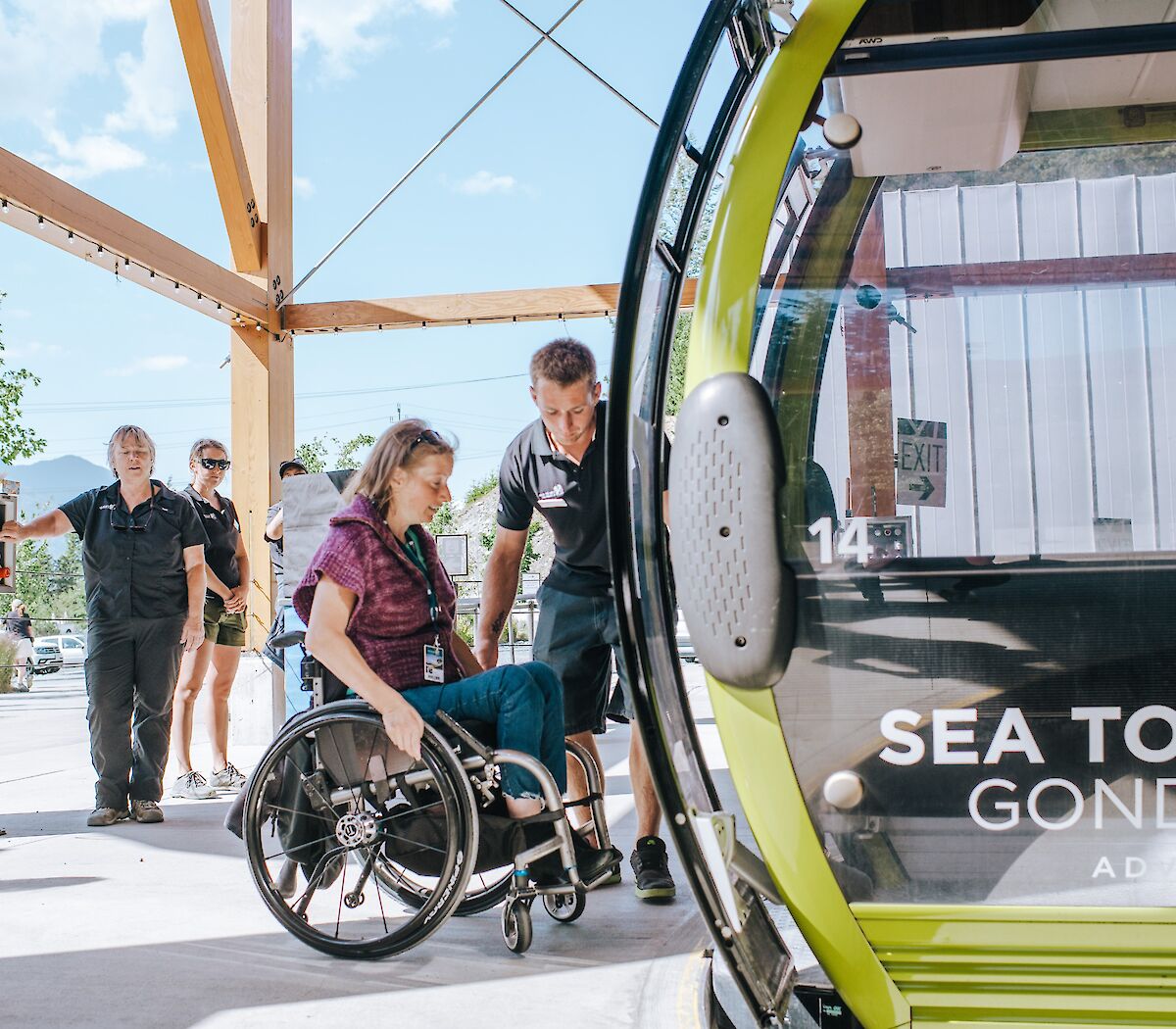a women in a wheelchair getting onto the gondola