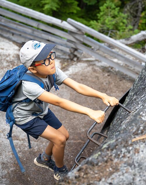 a younger boy climbing