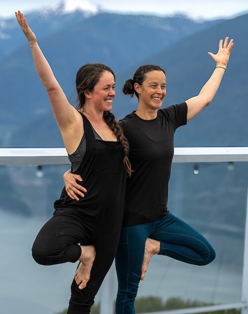 two yoga instructors posing
