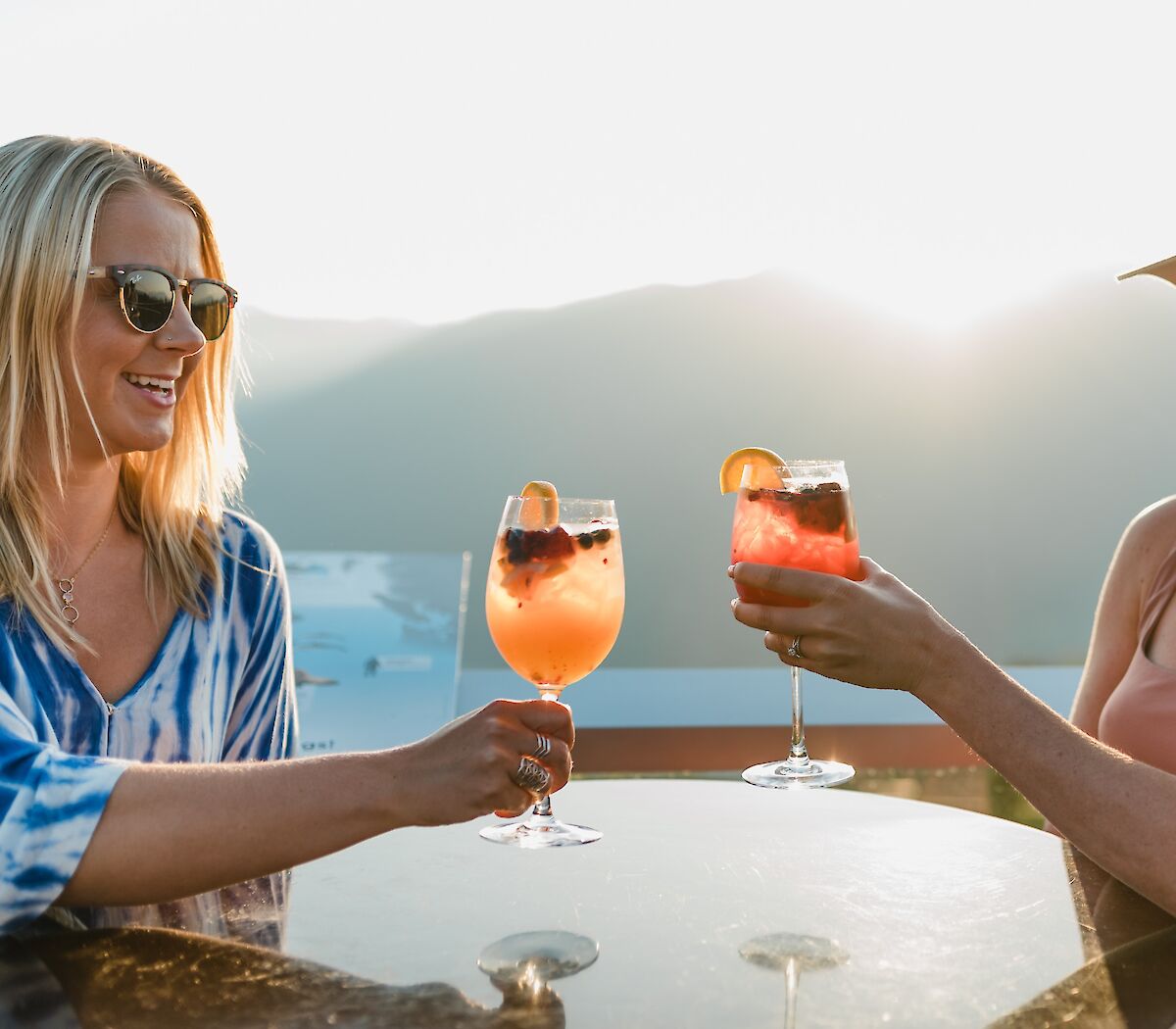 two women having a cocktail