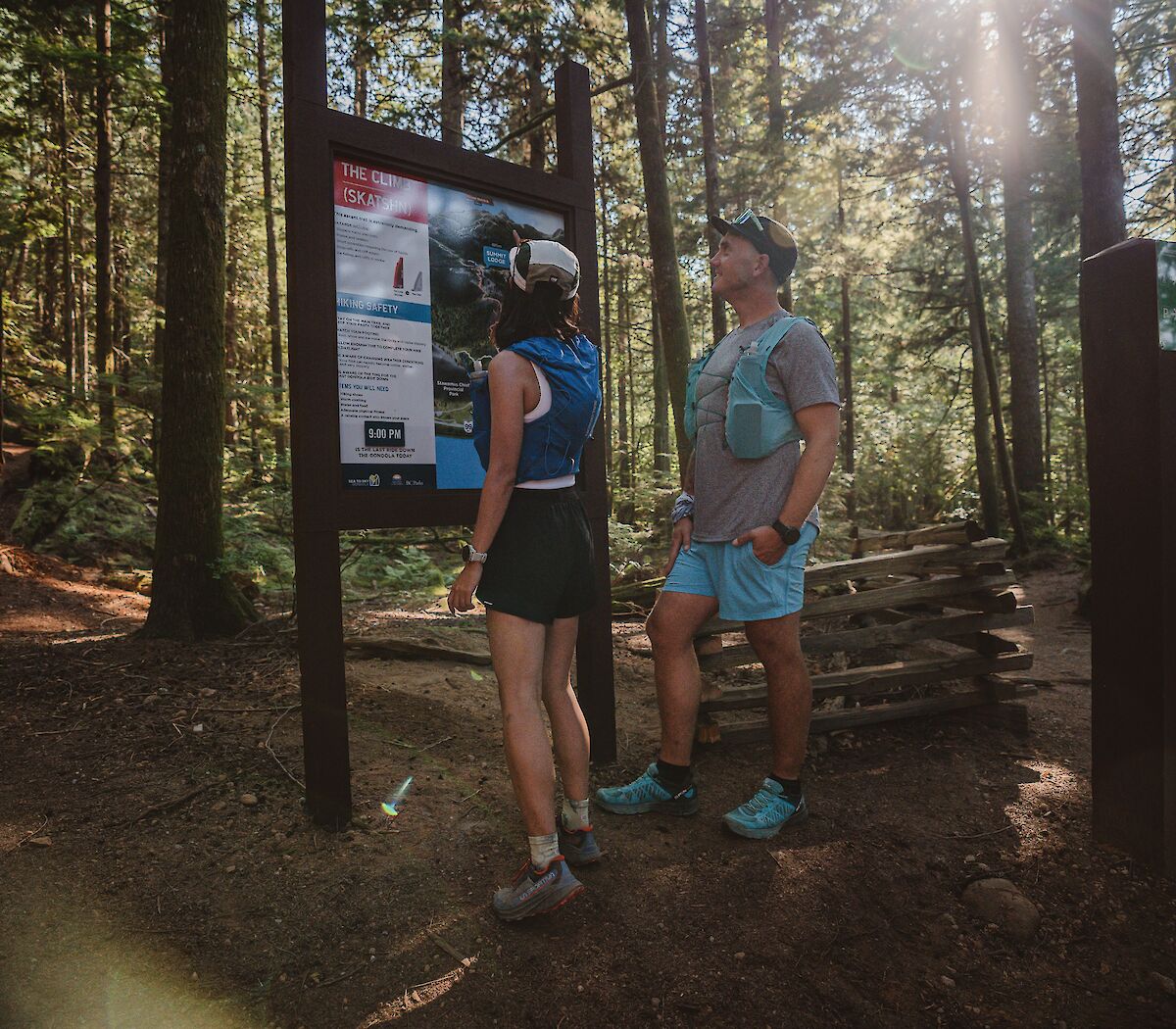 two people looking at a map board