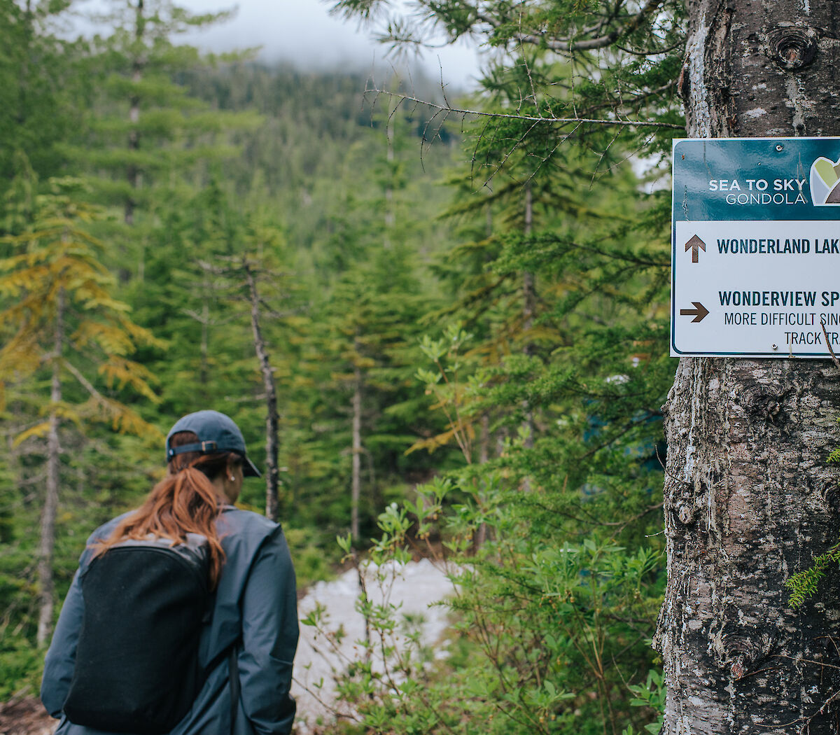 a women walking on the wonderland lake loop trail