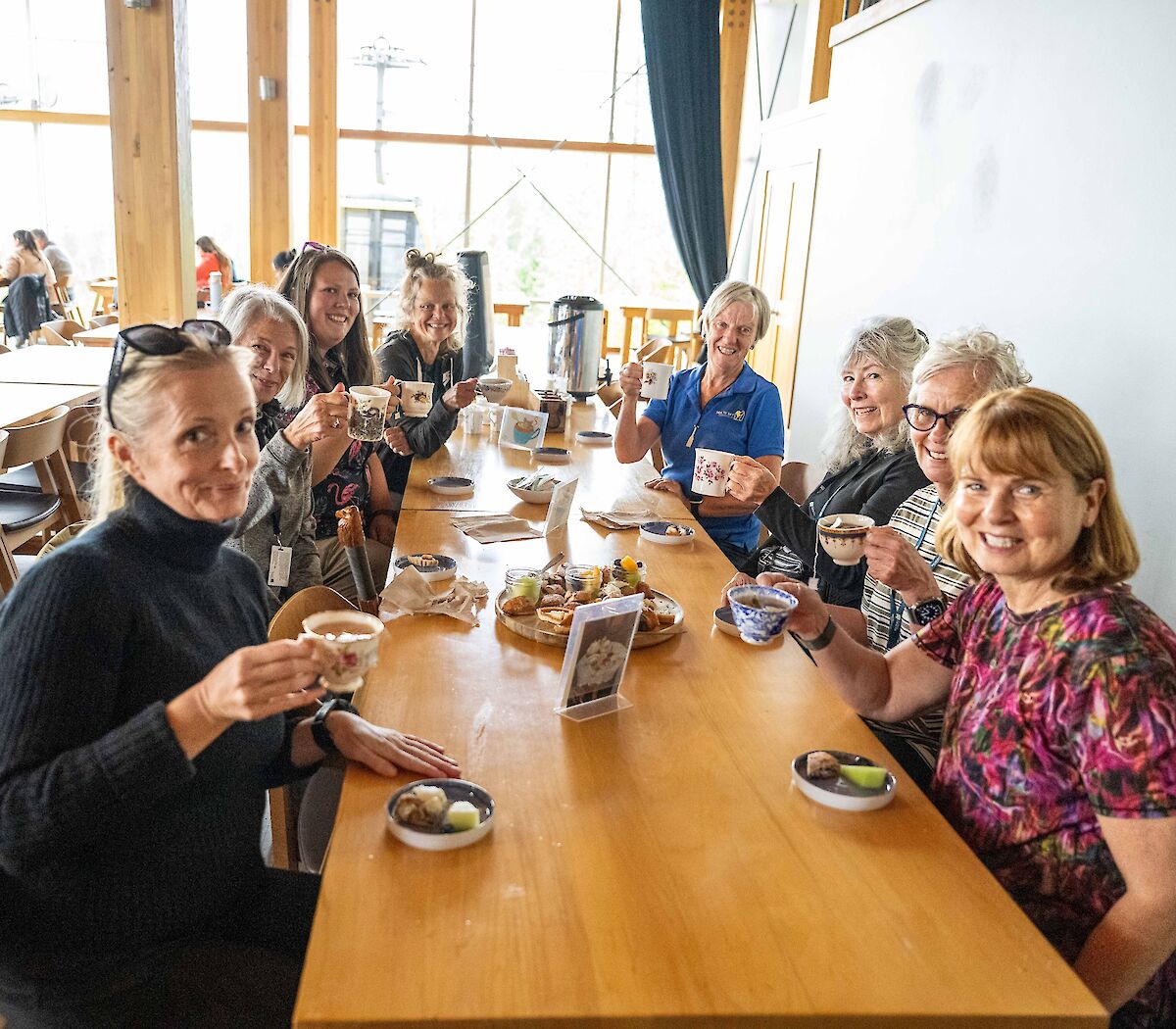 a group of ladies drinking tea