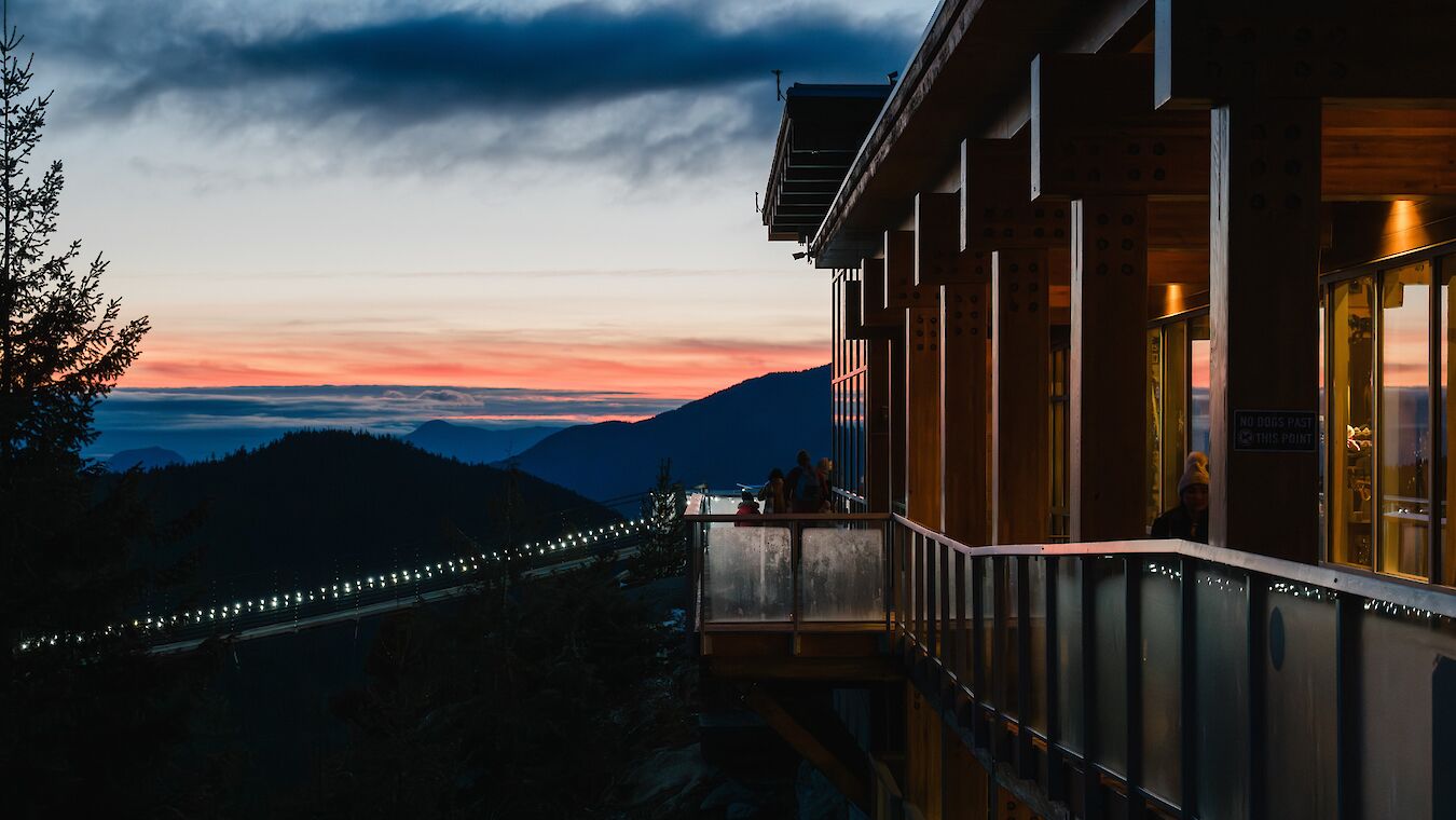 a view of the summit lodge with a sunset