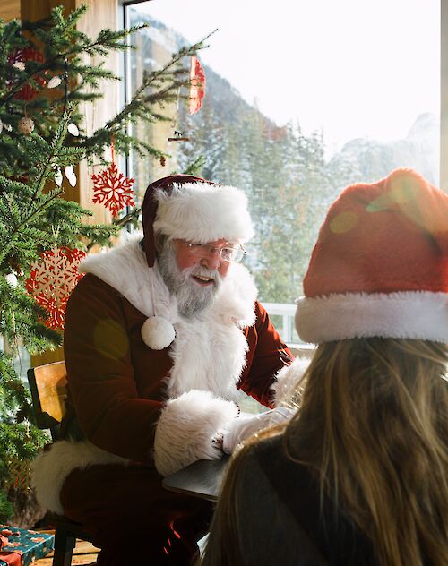 Santa talking to a young girl